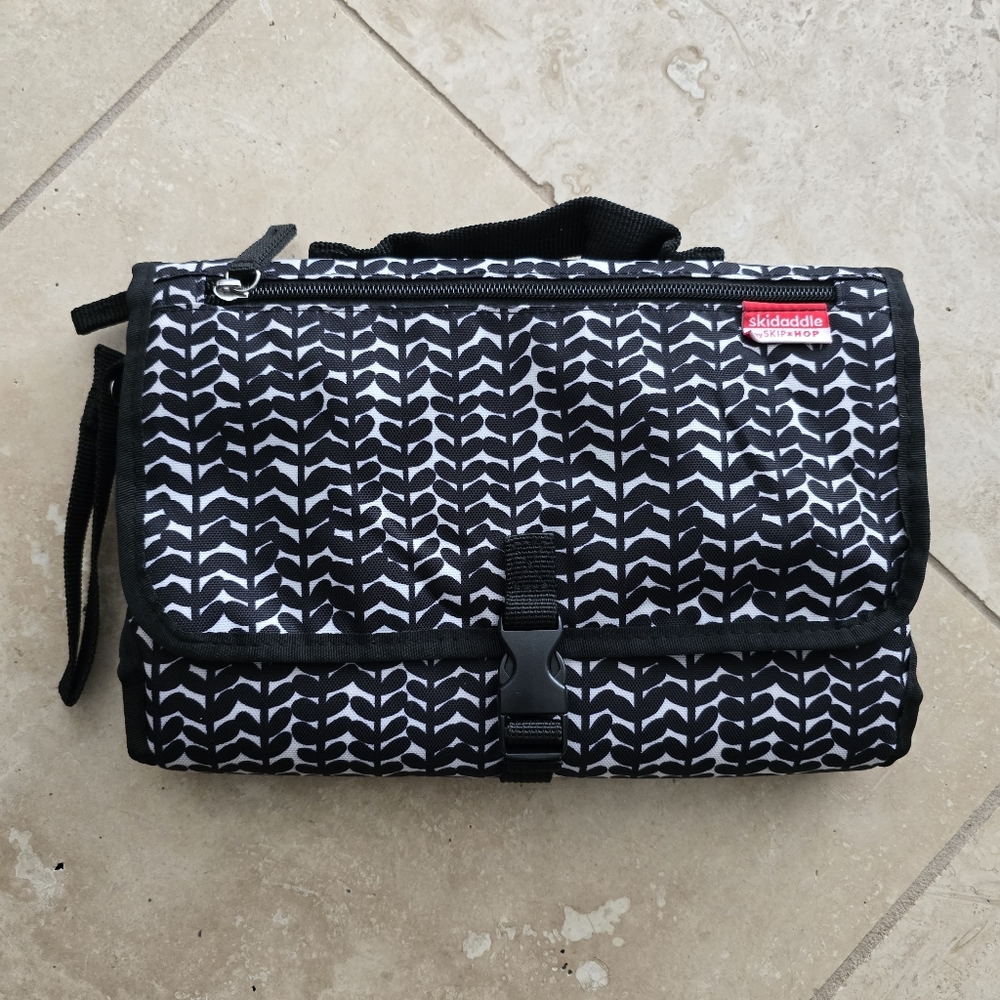 Skidaddle by Skip Hop Portable Diaper Changing Station in the Black Vine Pattern
